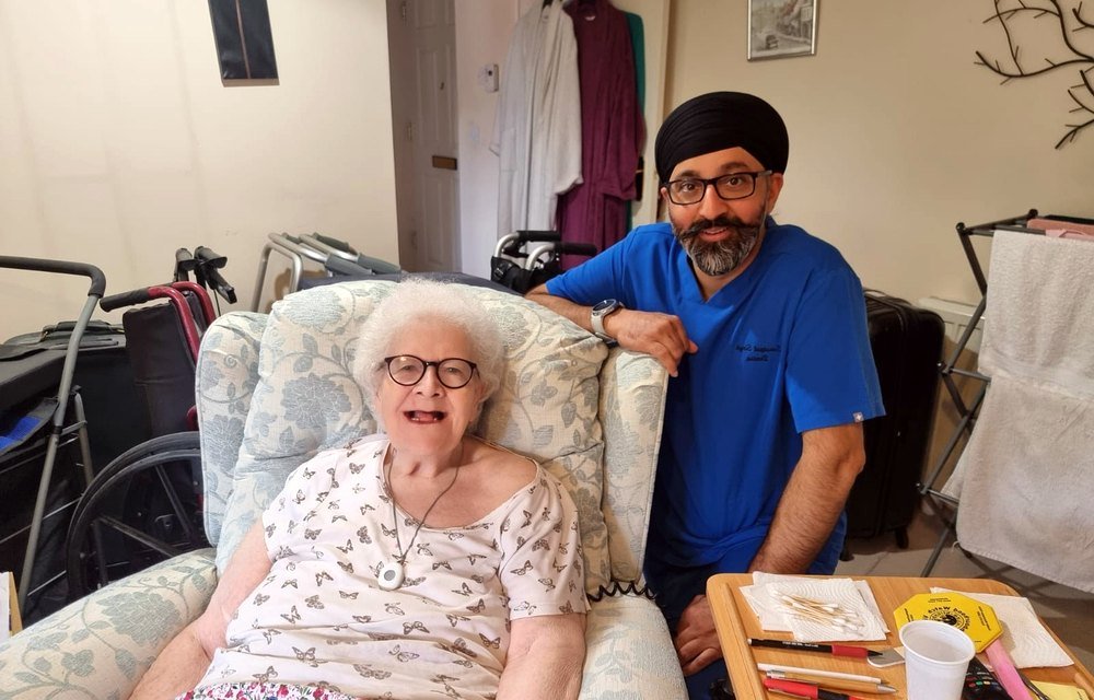 Home visit dentist caring for a patient at home in Birmingham